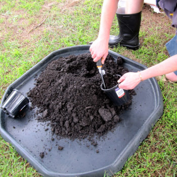 mixing soil on mixing trays